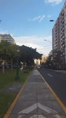 an empty city street with trees and buildings at Magdalena del Mar, mejor ubicación imposible in Lima