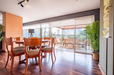 a dining room with a table and chairs at The Kennedy 3BR by Geko in Lima