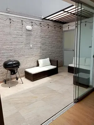 a room with a bed and a chair in it at Alquilo Departamento en Playa Pulpos in Lurín