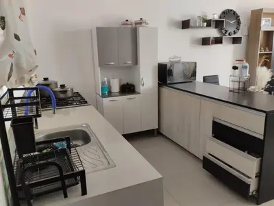 a kitchen with a sink and a counter at Acogedora casa en ICA - PERU in Ica