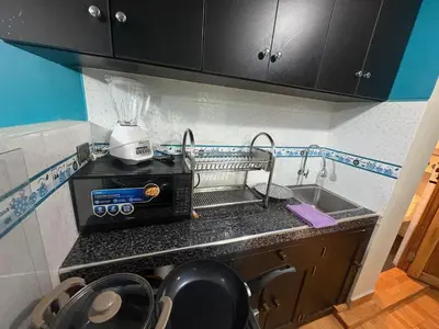 a kitchen with a sink and a blender on a counter at Nido Cusqueño in Cusco