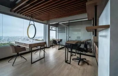 a room with a table and chairs and a large window at Loft Ale Piso 22 in Lima