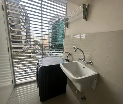 a bathroom with a sink and a large window at Pardo Miraflores Apartment - Aparts 4 Days in Lima