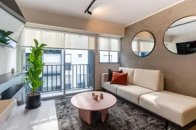 a living room with a couch and a table at Grimaldo by Geko in Lima