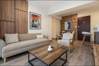 a living room with a couch and a table at Grimaldo by Geko in Lima