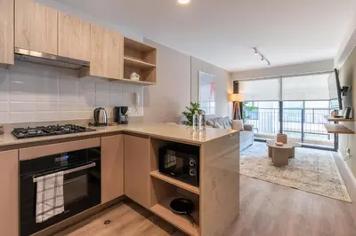 a kitchen with a stove and a counter top at Los Pinos by Geko in Lima