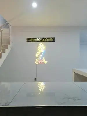 a sign on the wall of a building with a woman on it at Loft and reception RISHEL in Chincha
