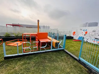 a playground with a play set on the grass at Monterrico Polo Aparts #22- Dpto 2 Dorm 2 baños - Frente Embajada USA in Lima