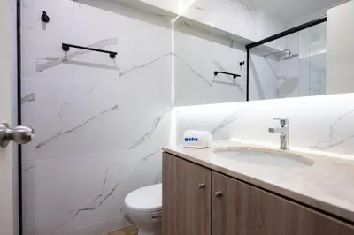 a bathroom with a sink and a toilet at The Rooftop 2BR by Geko in Lima