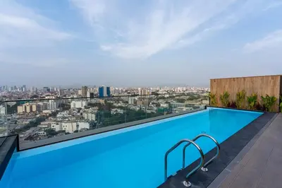 a swimming pool on the roof of a building at Miraflores Modern Apartments Benavides by Geko in Lima