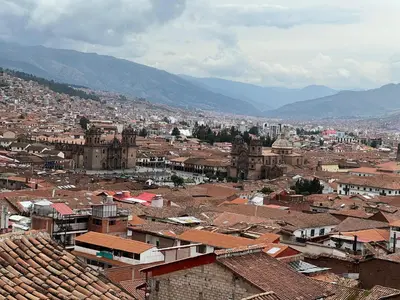 a view of a city with roofs and buildings at Auquis Hostel in Cusco