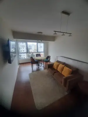 a living room with a couch and a table at 4 habitaciones in Lima