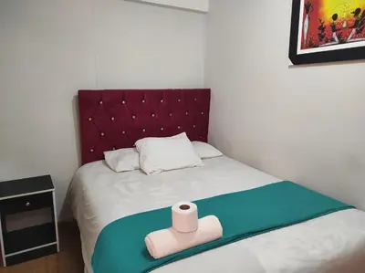 a bed with a roll of toilet paper on it at Hospedaje M&M in Cusco