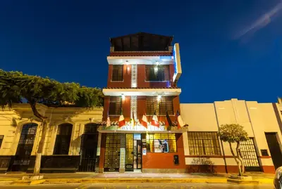 a building with a clock tower on top of it at Hostal Iquique in Lima