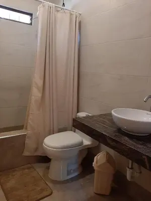 a bathroom with a toilet and a sink and a shower at Country house cieneguilla in Cieneguilla