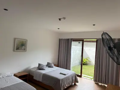 a bedroom with two beds and a large window at The Wismont club & hotel in La Merced
