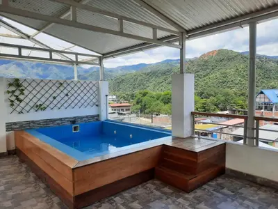 a swimming pool in a house with a view at Hotel Wismont Piñales in La Merced