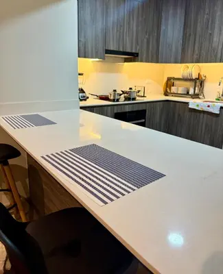 a kitchen with a white counter top in a kitchen at Rest, comfort and privacy in San Isidro in Lima
