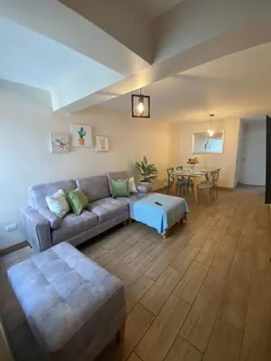 a living room with a couch and a table at Hermoso departamento estreno céntrico in Lima