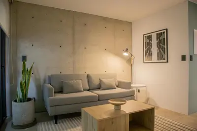 a living room with a couch and a coffee table at Arrieta by Wynwood House in Lima