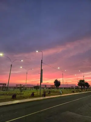 a street with street lights on the side of a road at Departamento con vista al mar en Lima in Lima