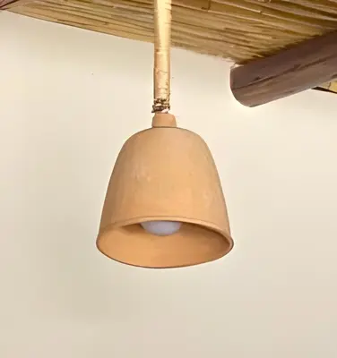 a light fixture hanging from a ceiling at ViaVia Ayacucho in Ayacucho