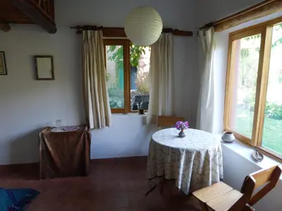 a dining room with a table and a window at Andean Spirit Lodge in Mollepata