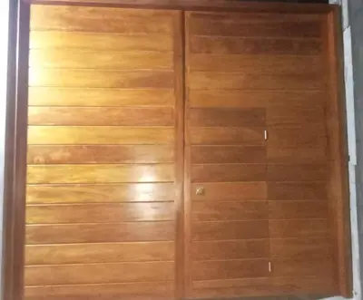a pair of wooden closets in a room at Habitacion con Cochera in Atico