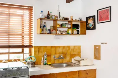 a kitchen with a sink and a counter top at The film House in Lima