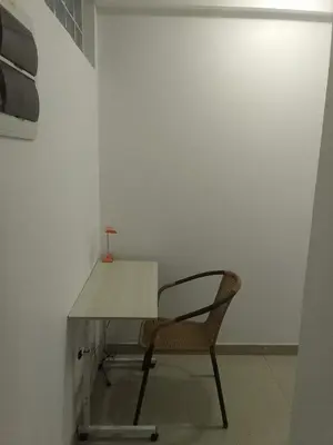 a chair sitting at a desk in a room at Departamento en Centro de Lima - Santa Beatriz in Lima