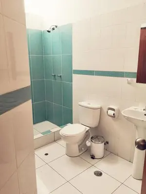 a bathroom with a toilet and a sink at Apartamento en Ayacucho in Ayacucho