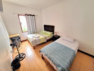 a room with two beds and a camera in it at Casa Villa Descanso in Lima
