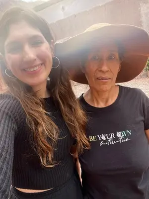 a woman is standing next to a man at hostel arcoiris urubamba in Urubamba