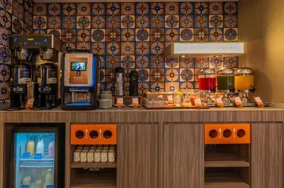 a drink bar in a hotel room with a drink cooler at Hampton By Hilton Cusco in Cusco