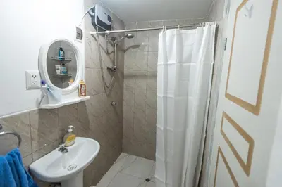 a bathroom with a shower and a sink at Alojamiento en Centro Histórico Cusco in Cusco