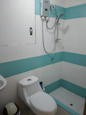 a bathroom with a toilet and a shower in it at Macchi in Ayacucho