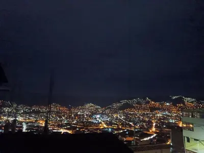 a view of a city lit up at night at Sanblas House in Cusco