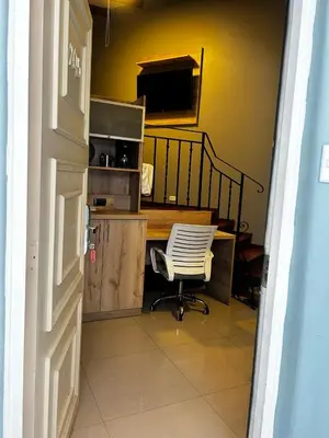 an office with a desk and a chair in a room at Serendipia Studio Loft in San Isidro 205 in Lima
