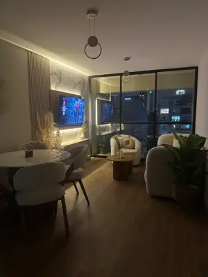 a living room with a couch and a table at Beautiful brand new apartment in an excellent area in Lima
