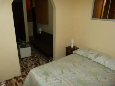 a bedroom with a bed in a room at Matryoshka in Ica