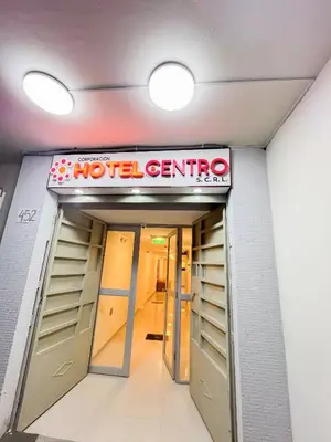 a motel entrance with a sign above the doors at Hotel Centro Huancayo in Huancayo