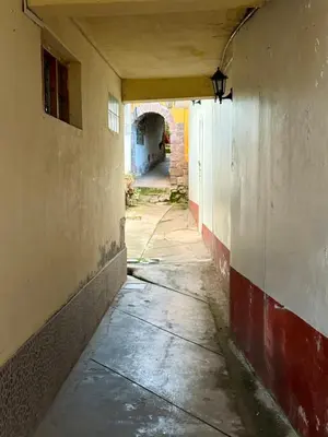 an empty hallway in an old building with a tunnel at Rustic House in the Heart of Cusco in Cusco