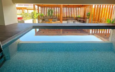 a swimming pool in a house with a patio at Duplex con piscina en Miraflores in Lima