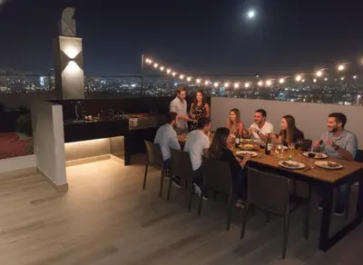 a group of people sitting around a table on a rooftop at Relajar y trabajar en Miraflores in Lima