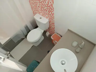a small bathroom with a toilet and a sink at Asia - Condominio Las Terrazas - departamento lindo y confortable in Islote Los Leones