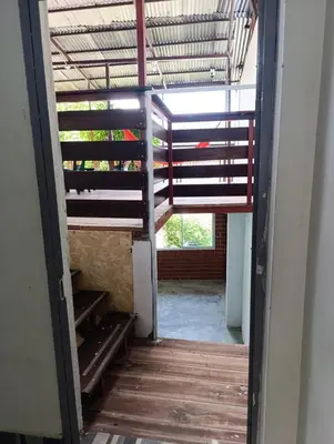 an open door to a room with a stair case at Casa Hospedaje terraza con vista a La Merced in La Merced