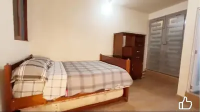 a bedroom with a bed and a dresser at Casa Hospedaje terraza con vista a La Merced in La Merced