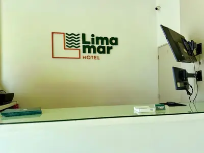 a sign for a line mire hotel on a wall at Hotel Limamar in Lima