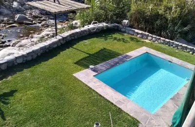 a swimming pool in the middle of a yard at Casa linda de Chontay junto al rio in Chontay
