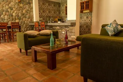a living room with two couches and a coffee table at Casa linda de Chontay junto al rio in Chontay